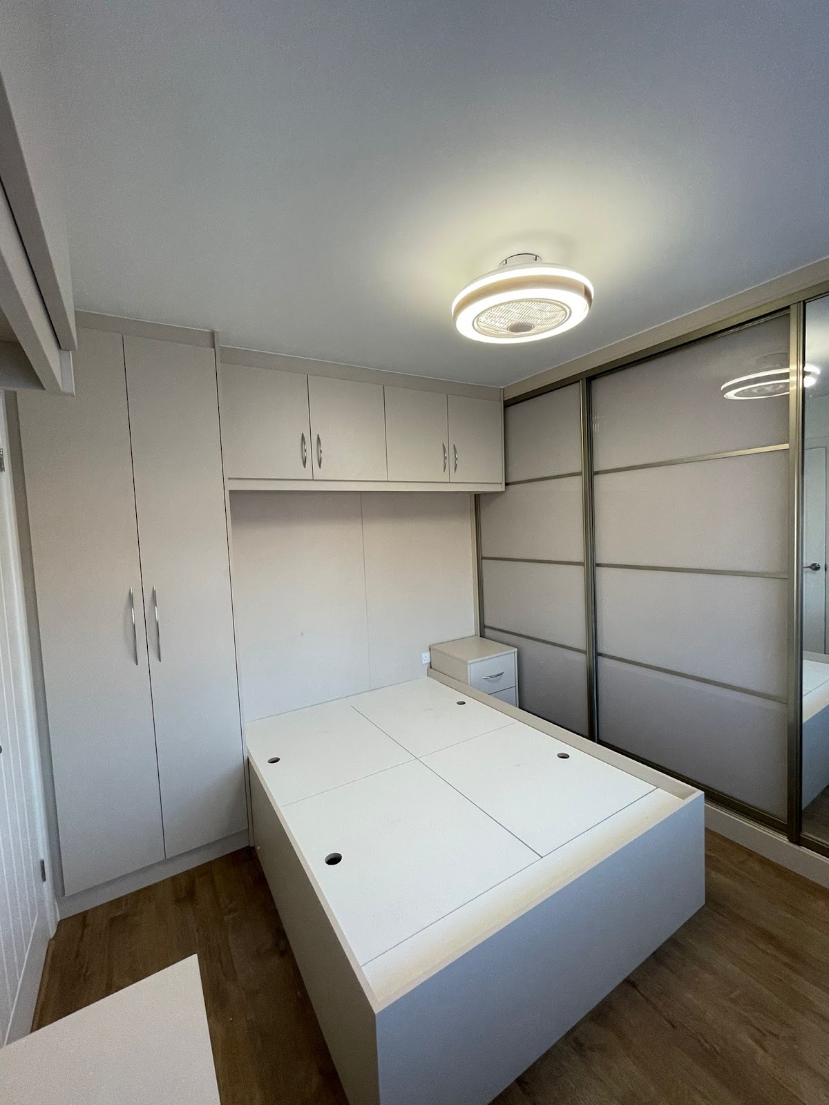 Fitted bedroom storage and mirrored wardrobe