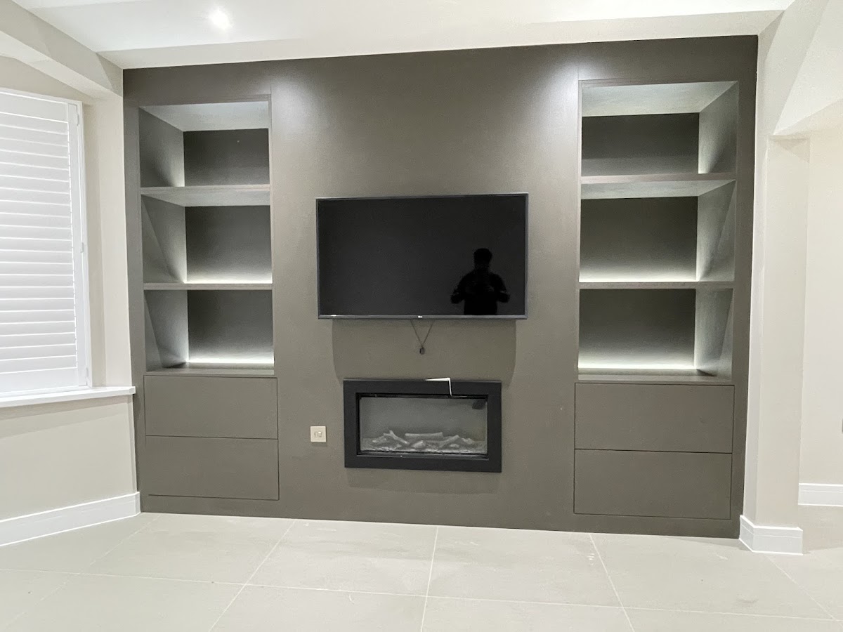 Media wall with integrated fire and illuminated display shelving